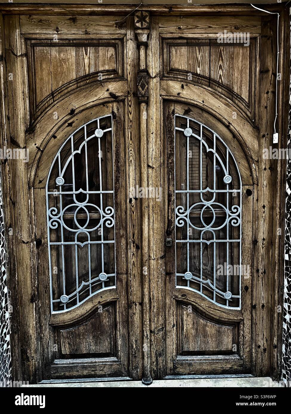 Wooden door in a Mediterranean village Stock Photo