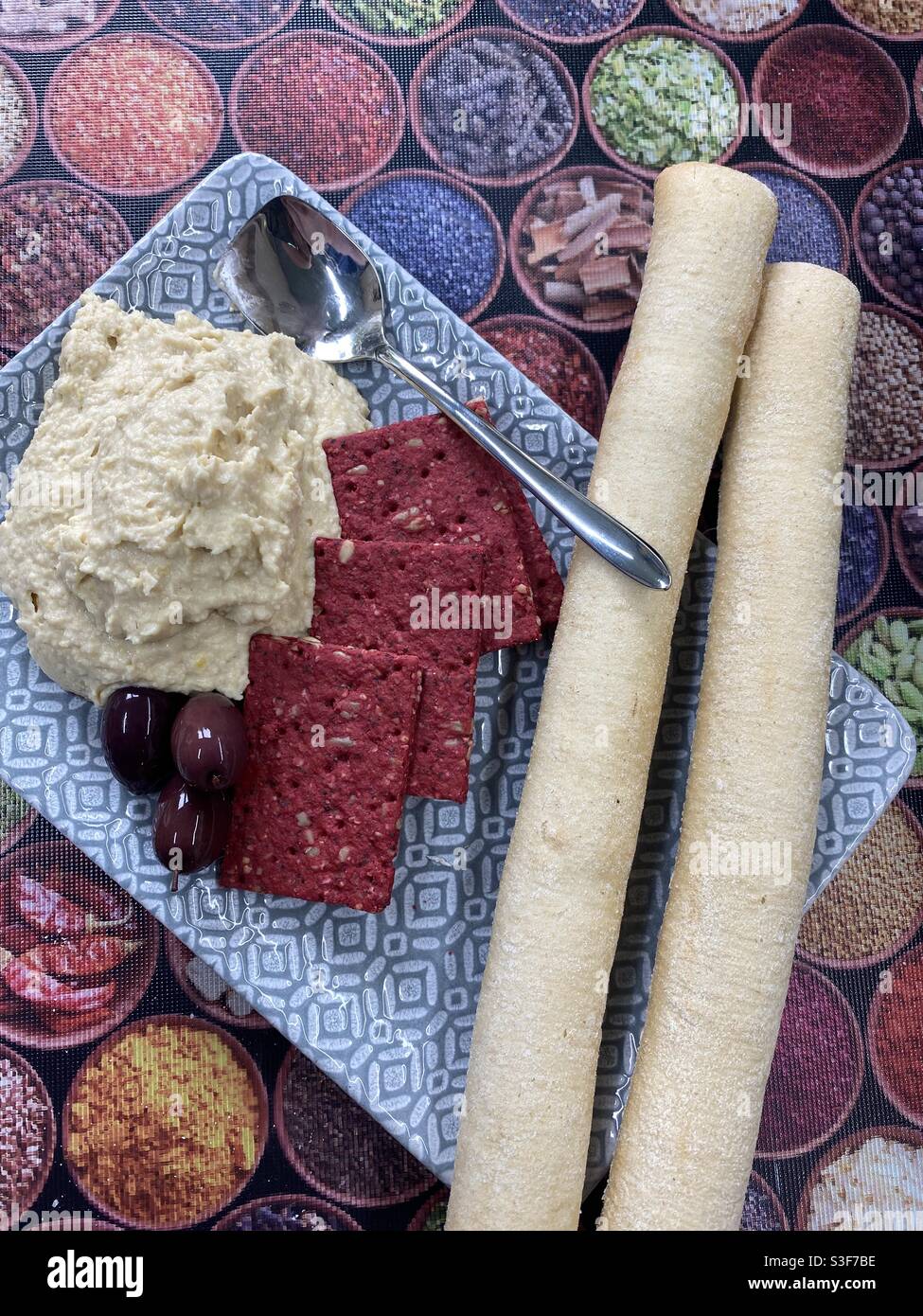 Chickpea Homous, Beetroot Seeded Oat Cake, Greek Olives, Bread Sticks - Smartphone Captured Stock Image