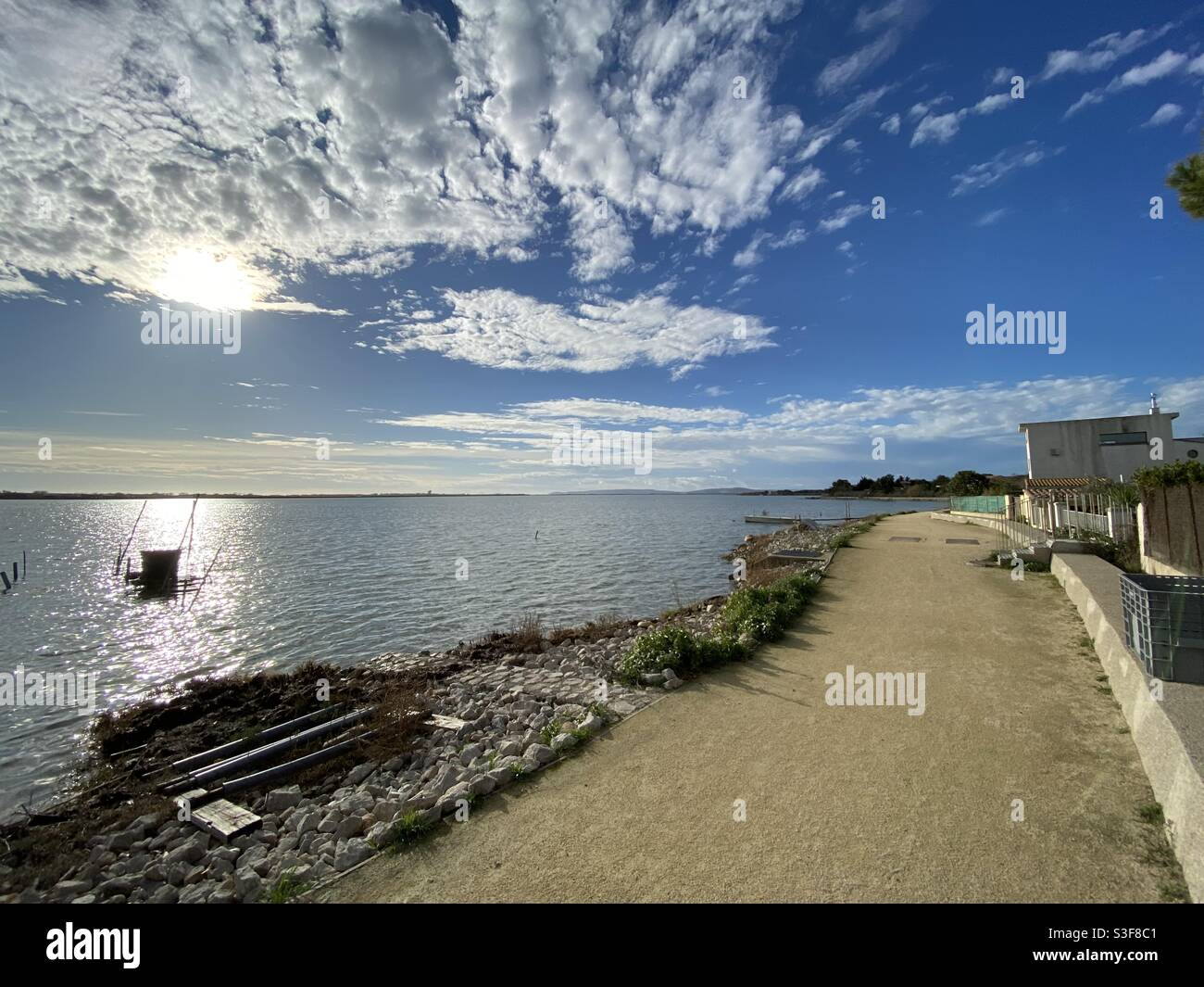 Sunset over a salt lake in Mauguio near Palavas les Flots, Carnon Plage and Montpellier, Occitanie, south of France - Smartphone Captured Stock Image
