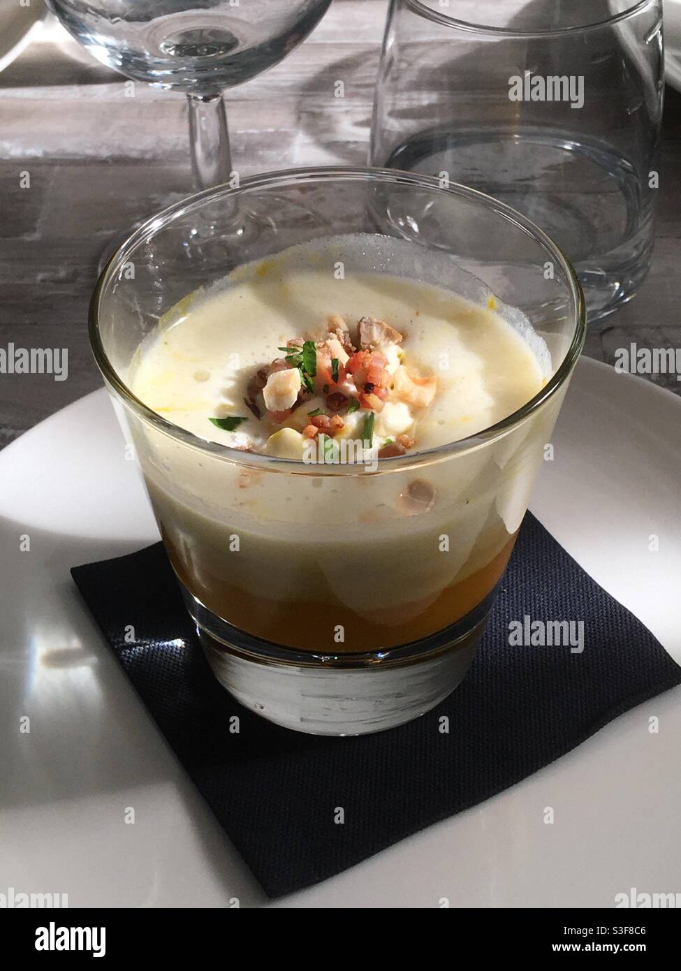 Frothy consommé in a French restaurant in Palavas les Flots near Carnon Plage and Montpellier, Occitanie, south of France - Smartphone Captured Stock Image