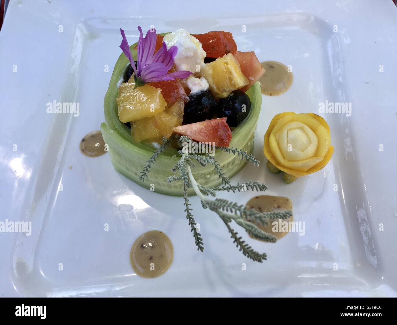 Fresh, exotic fruit salad desert dish plate in a French restaurant in Valergues near Montpellier, Occitanie, south of France - Smartphone Captured Stock Image