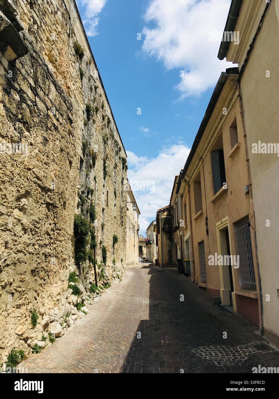 Small paved street in a French village near Baillargues and Montpellier, Occitanie, south of France - Smartphone Captured Stock Image
