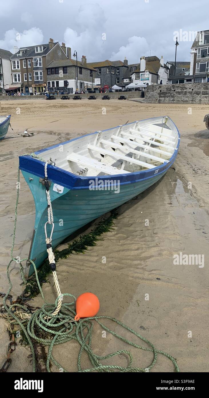 Real boat at low tide on St Ives Harbour Stock Photo