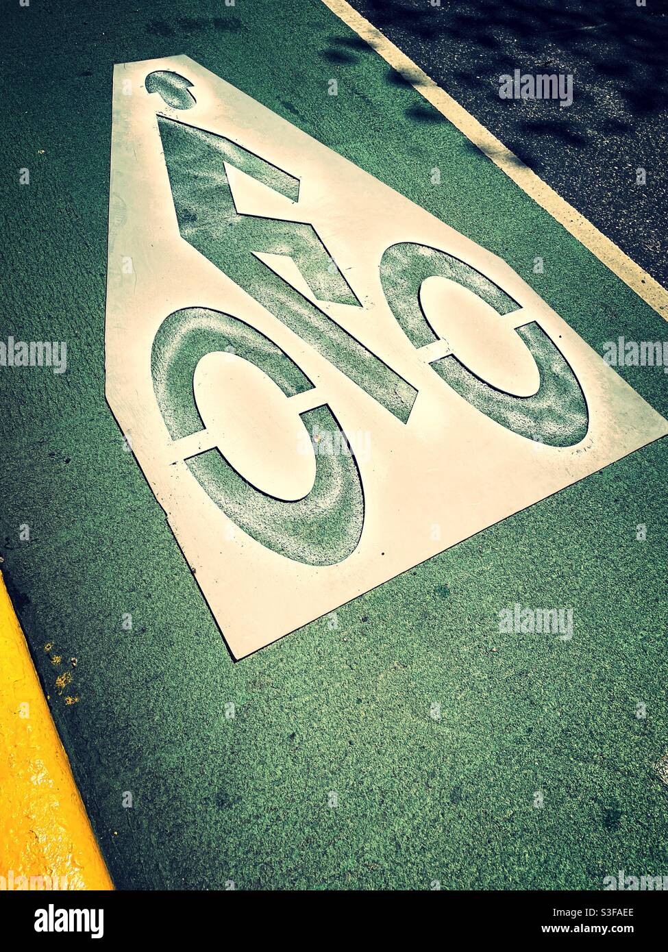 Stencil marking a bike lane in New York City, USA - Smartphone Captured Stock Image