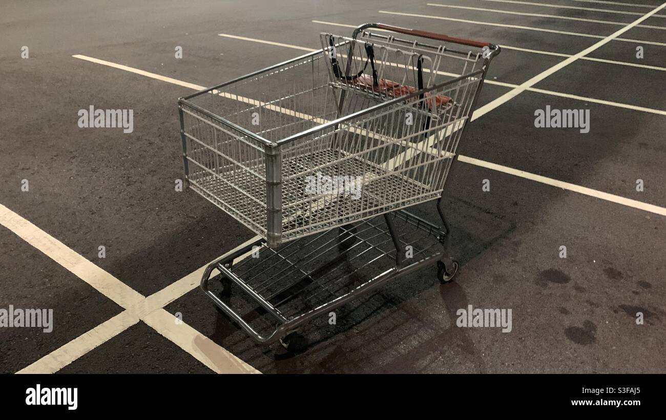 Shopping cart at parking lot Stock Photo Alamy