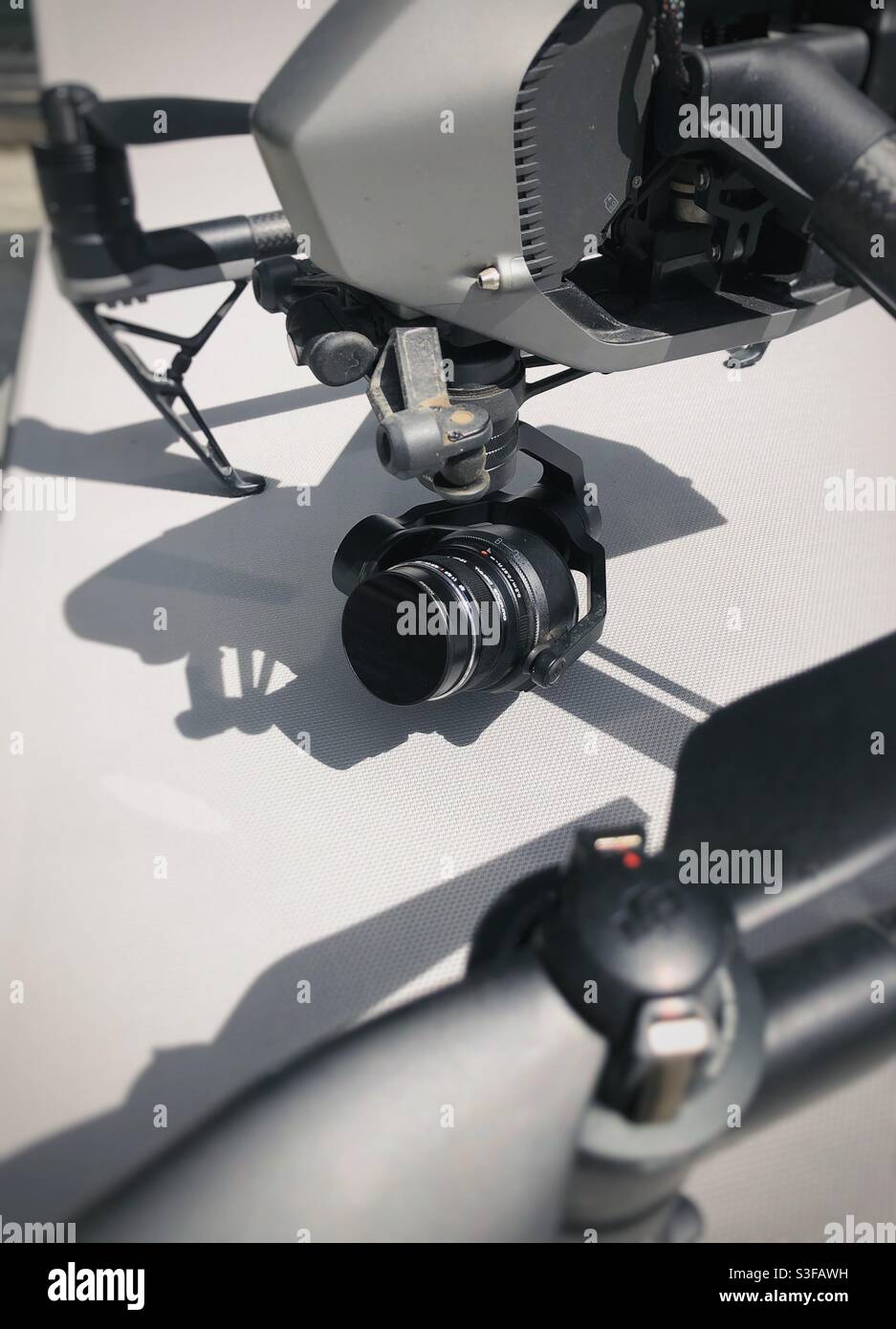 Camera and lens on the gimbal of a DJI drone Stock Photo
