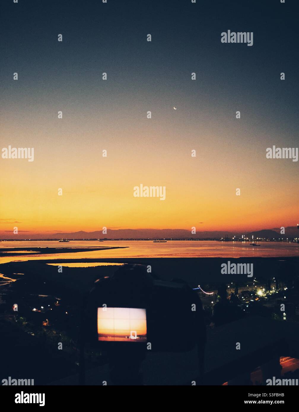 Setting up a camera for a landscape shot. Stock Photo