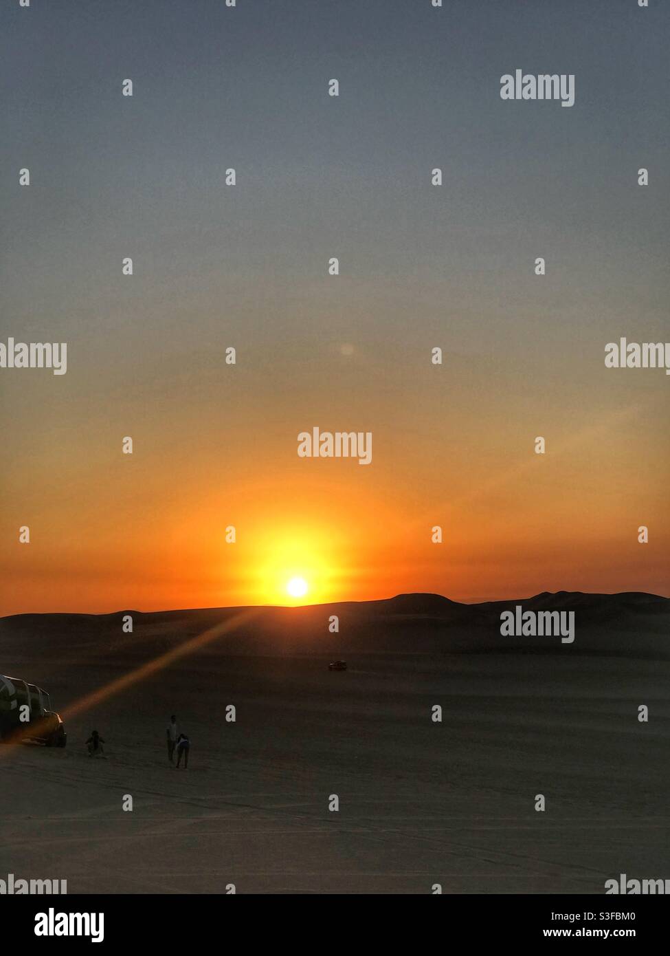 Sunset on a dune buggy tour in Huacachina, Peru - Smartphone Captured Stock Image