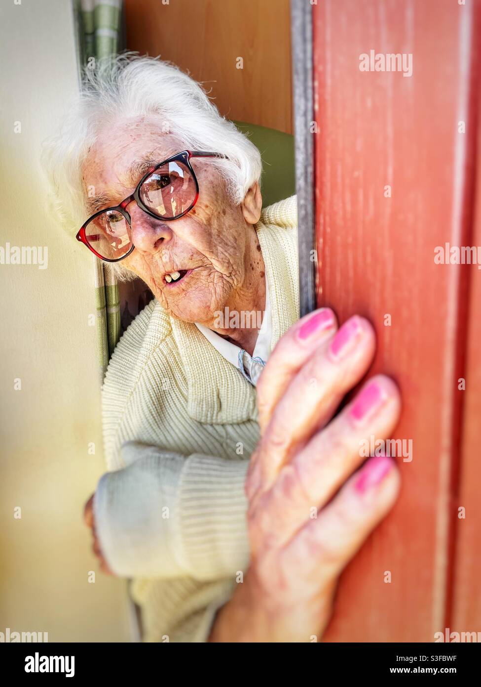 Elderly woman in isolation at a care home due to Covid-19 restrictions - Smartphone Captured Stock Image