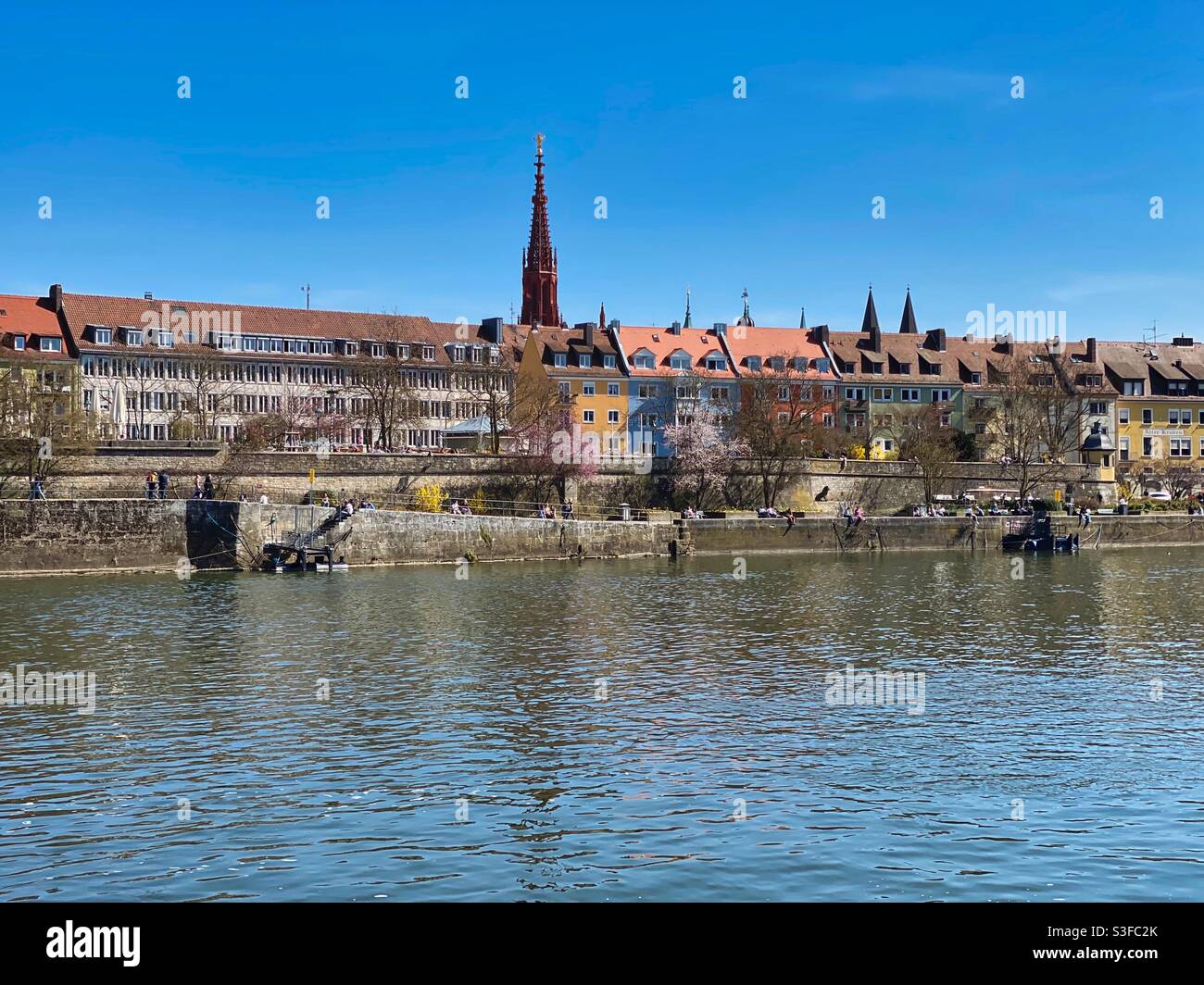 Riverfront of Main and colorful houses in the historical center of Würzburg, Germany. - Smartphone Captured Stock Image