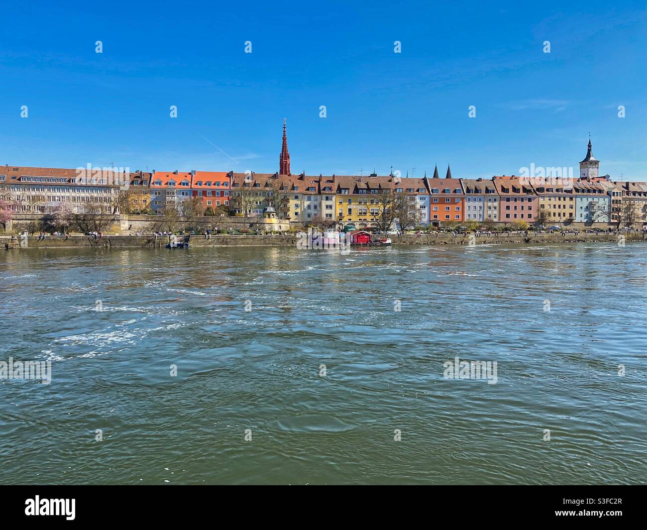 Riverfront of Main and colorful houses in the historical center of Würzburg, Germany. - Smartphone Captured Stock Image