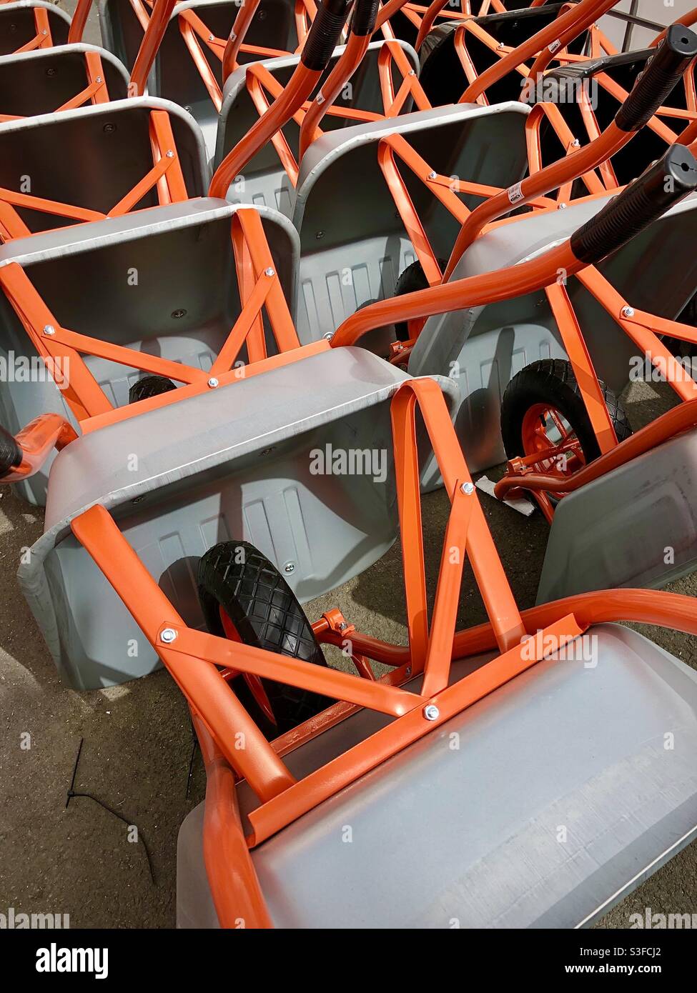Display of metal wheelbarrows in builders supply store. - Smartphone Captured Stock Image