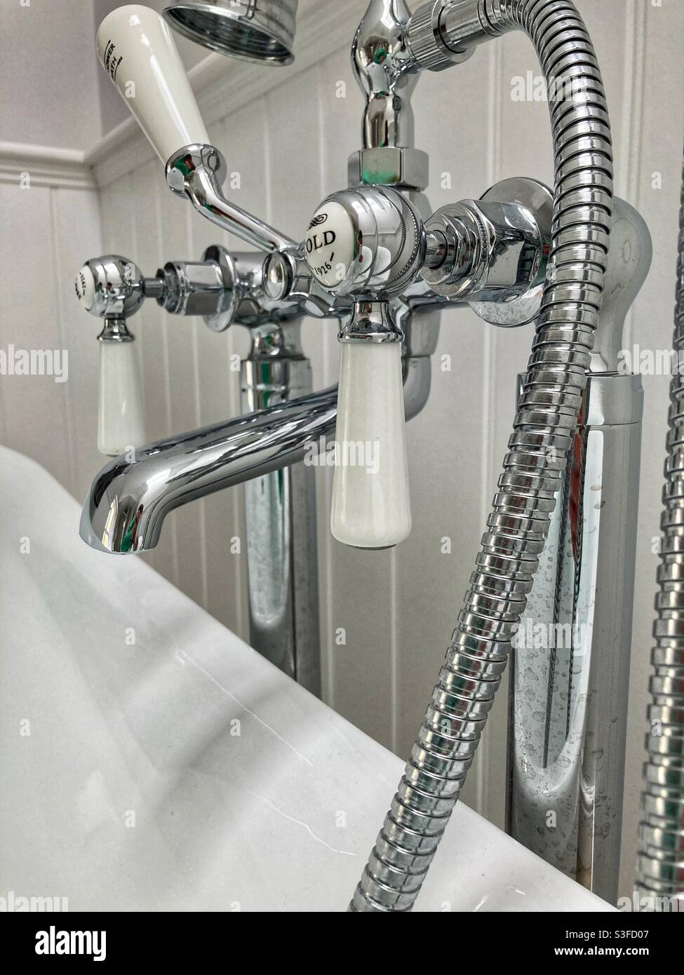 Bath taps / bathroom taps / hot tap / cold tap / basin / water supply Stock Photo