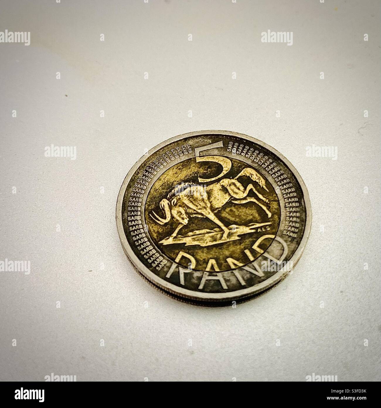 Dirty money. South African five Rand coin. R5. Bimetal coin. Stock Photo