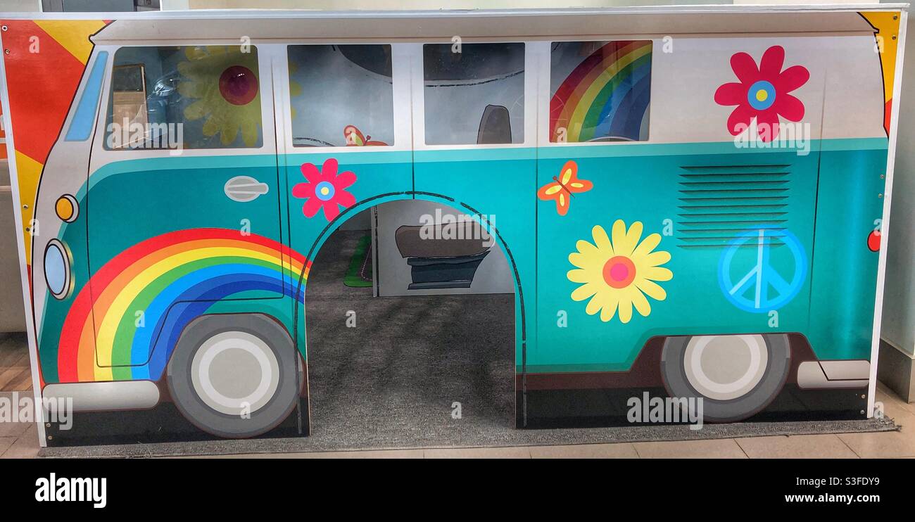 A children’s play area in the form of VW van painted in bright colours. - Smartphone Captured Stock Image