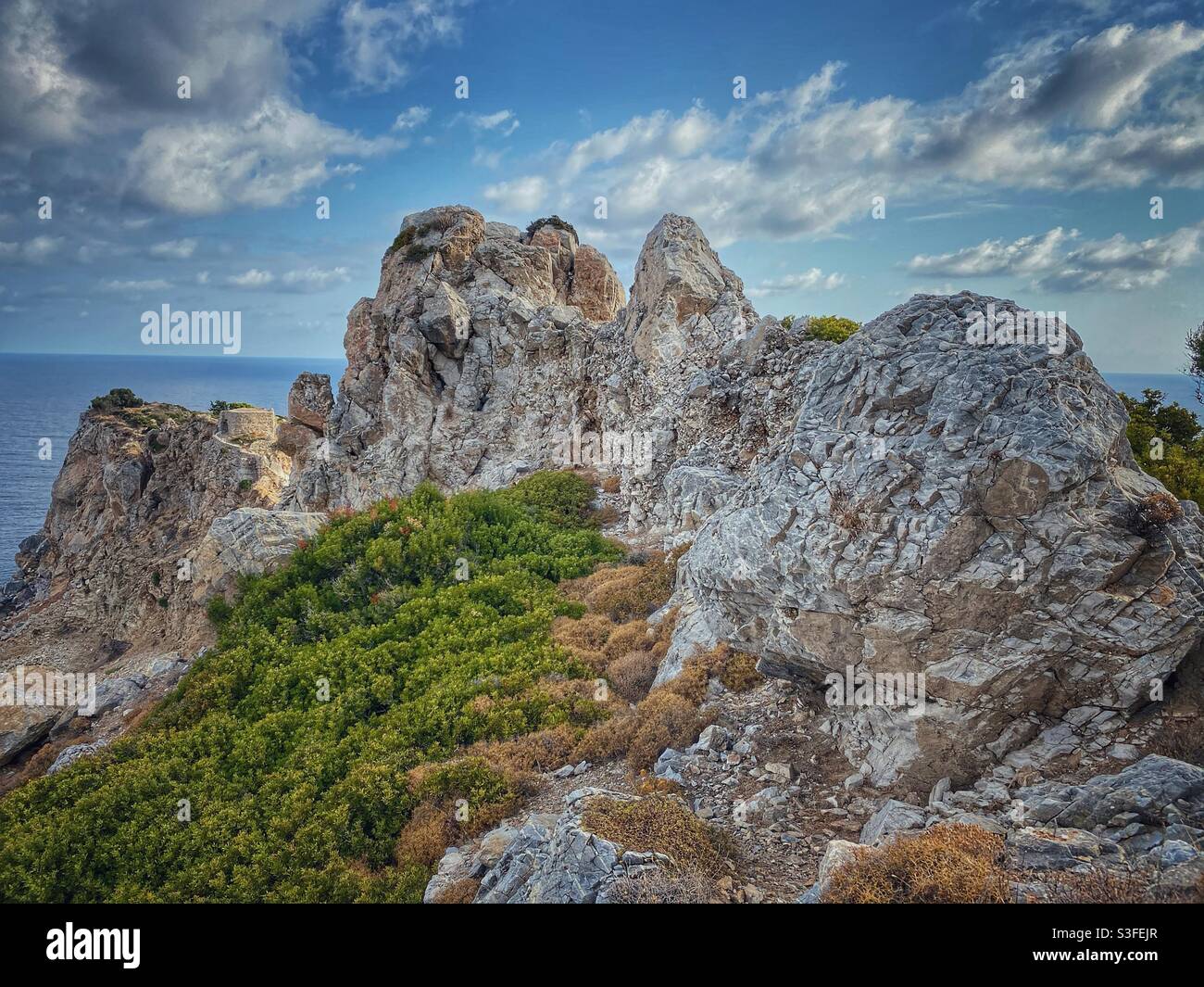 Rocks and cliffs near Kastro fortress on the North of Skiathos island, Greece. Stock Photo
