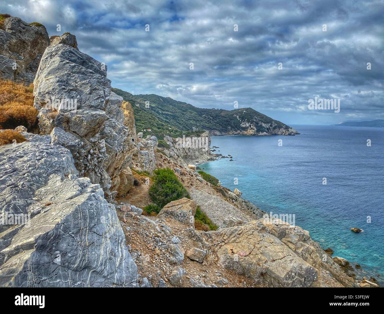 Sea coast with big rocks and cliffs on the North of Skiathos island, Greece. Stock Photo
