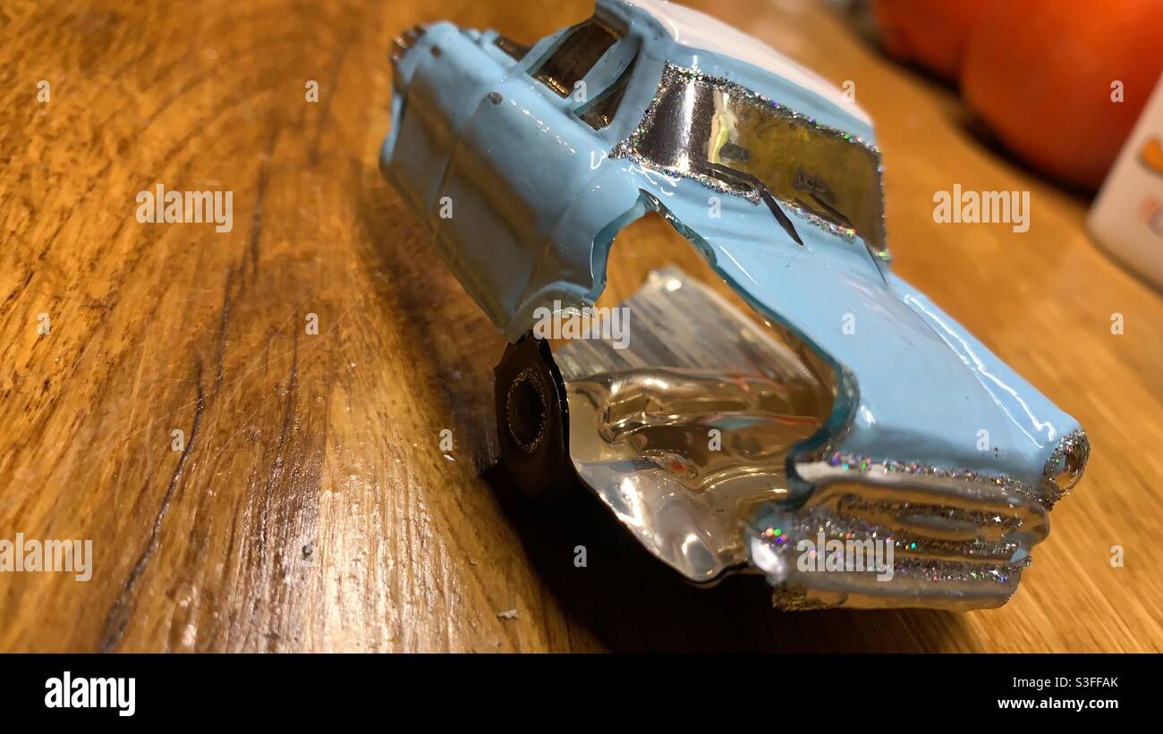 Broken Christmas glass toy car. Stock Photo