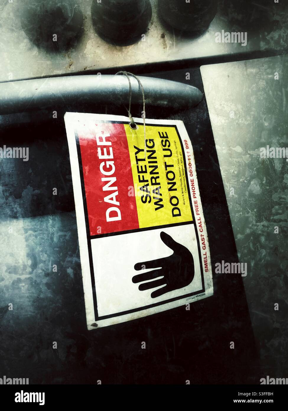 Danger safety warning sign on old gas appliance condemned as unsafe for use Stock Photo