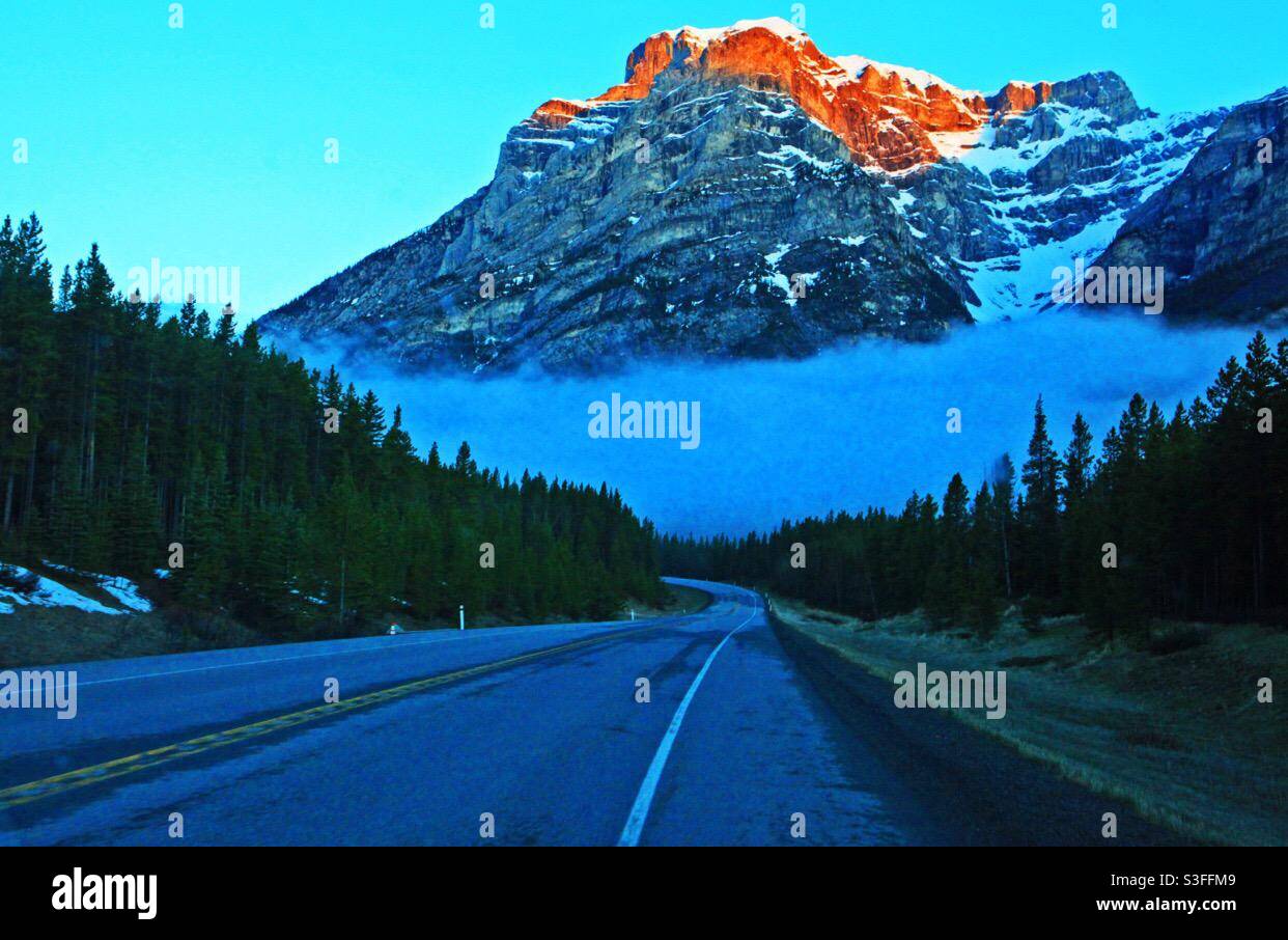 Mount Baldy, sunrise, Rocky Mountains, Canadian Rockies, Kananaskis Country, road to the mountains, wilderness, wilds, forest - Smartphone Captured Stock Image