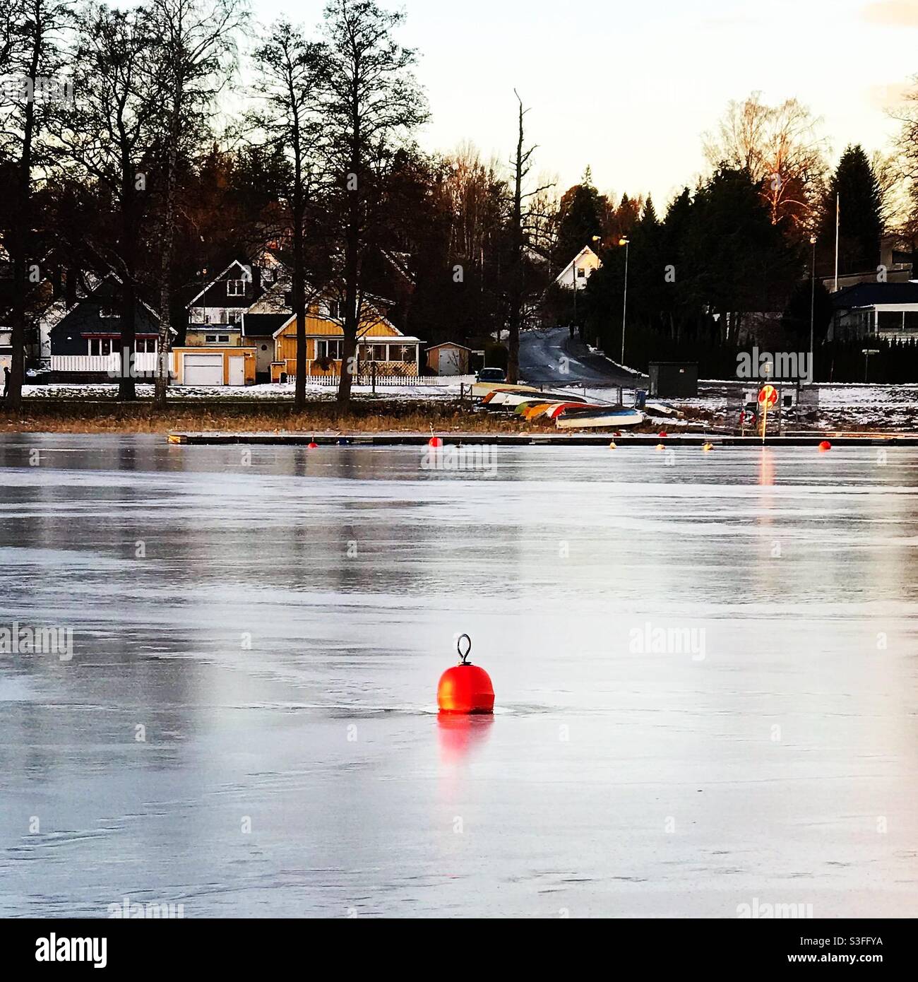 A buoy in a frozen lake in Sweden - Smartphone Captured Stock Image