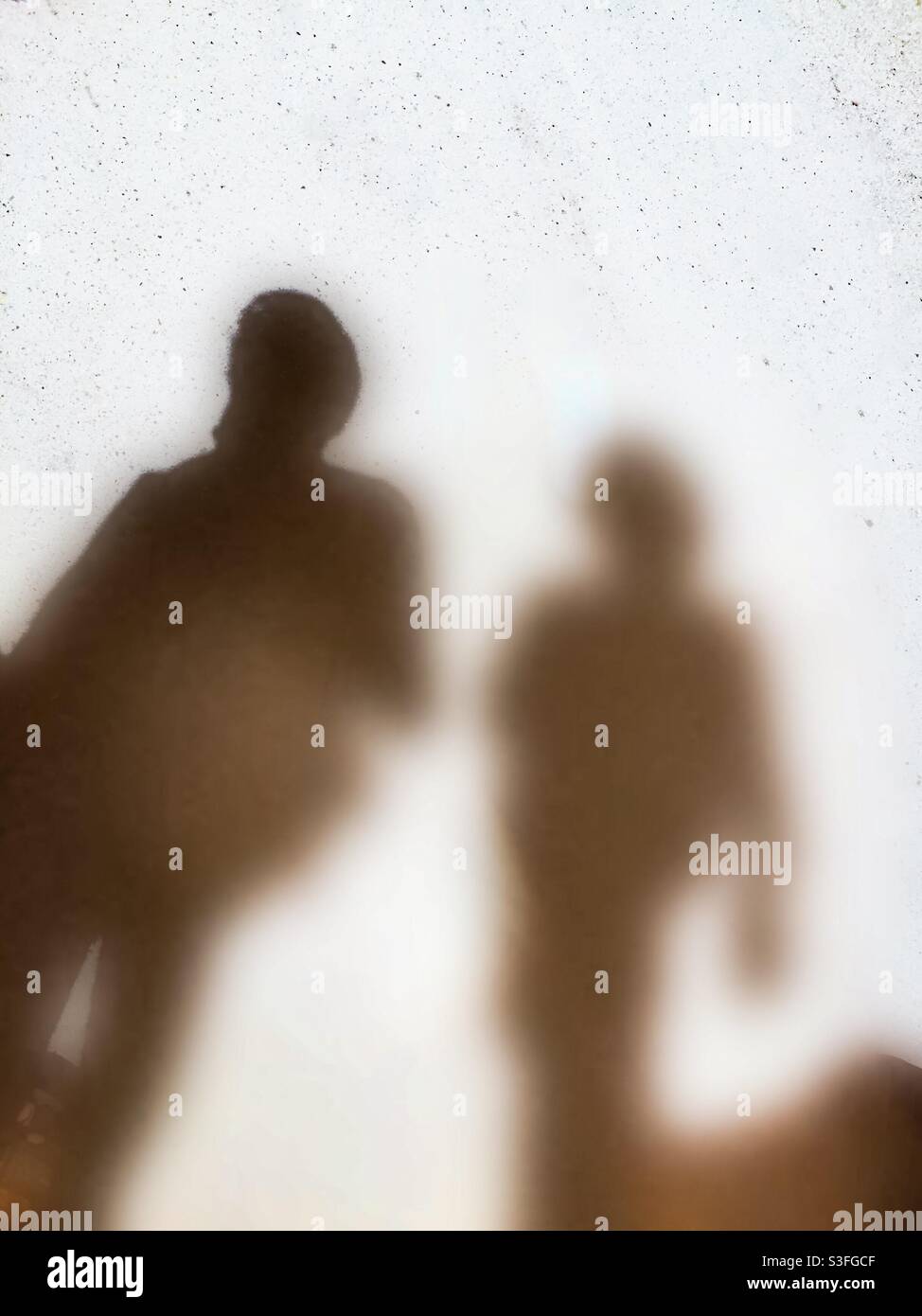 Phantoms. My parallel self, walking beside me. Concepts: shadow, fleeting, fugacious, states, companionship, penumbra, metaphor, dark matter, journey. walking with me - Smartphone Captured Stock Image