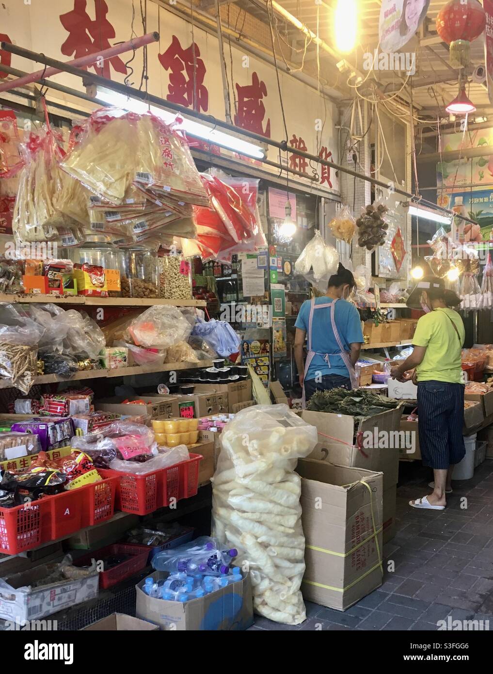 Person buying produce from local store in Sai Kung, Hong Kong. Stock Photo