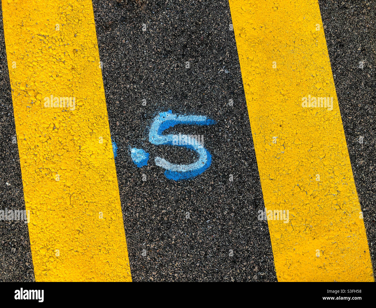 The number five painted on a street floor - Smartphone Captured Stock Image