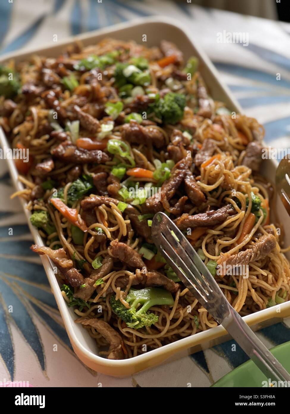 Chinese egg noodles with stir fried pork and greens - Smartphone Captured Stock Image