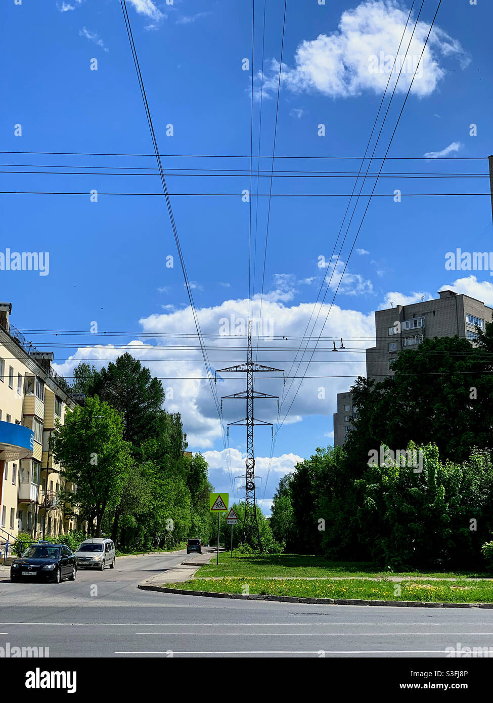 view of the power line passing through the city - Smartphone Captured Stock Image