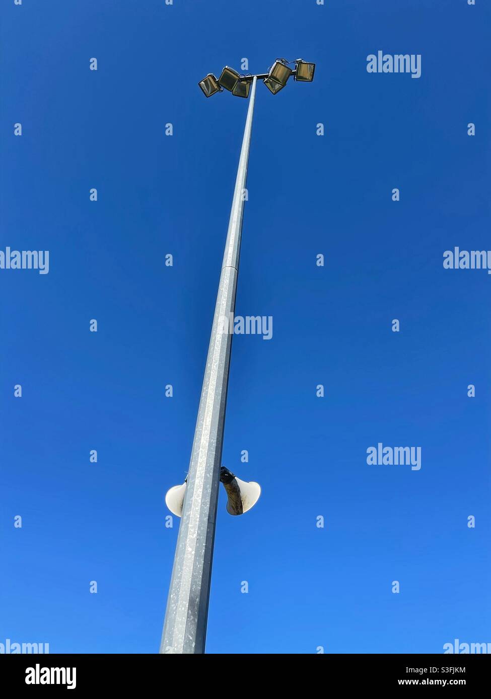 Light tower and bullhorn speakers at a sports ground - Smartphone Captured Stock Image