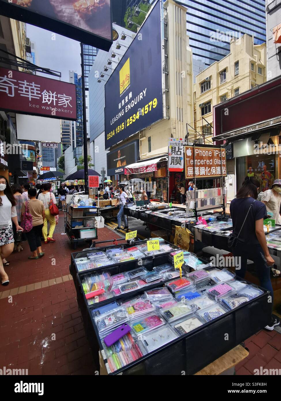 Vendors selling smartphone covers and accessories in a market in Causeway Bay in Hong Kong. - Smartphone Captured Stock Image