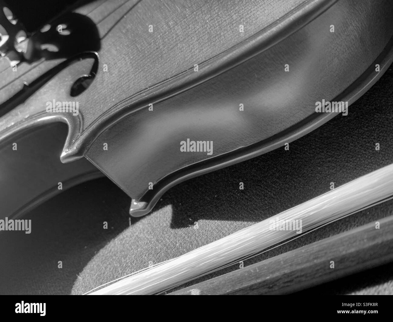 Glimpses of a violin and bow in black and white - Smartphone Captured Stock Image