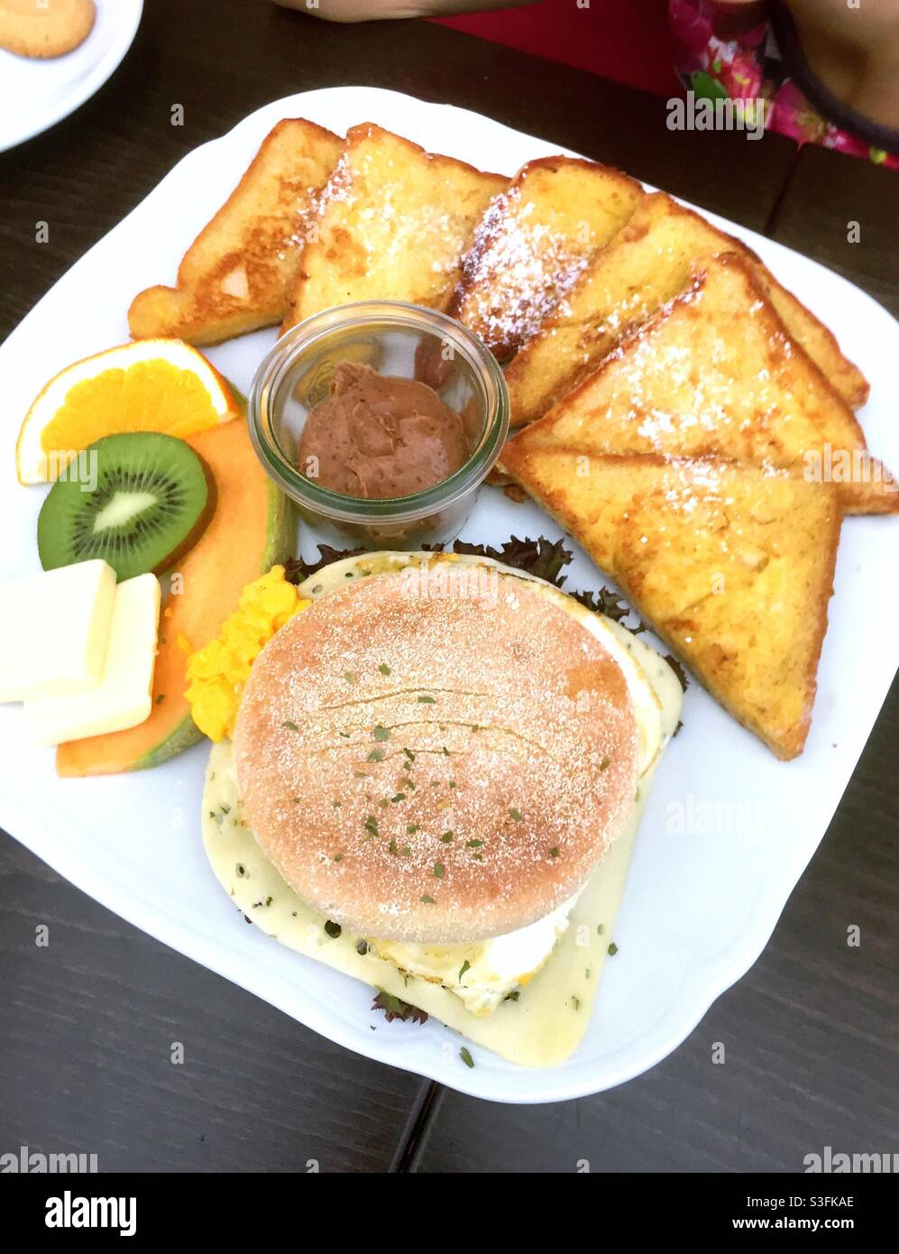 Healthy breakfast with French toast fruits and whole wheat bread roll - Smartphone Captured Stock Image