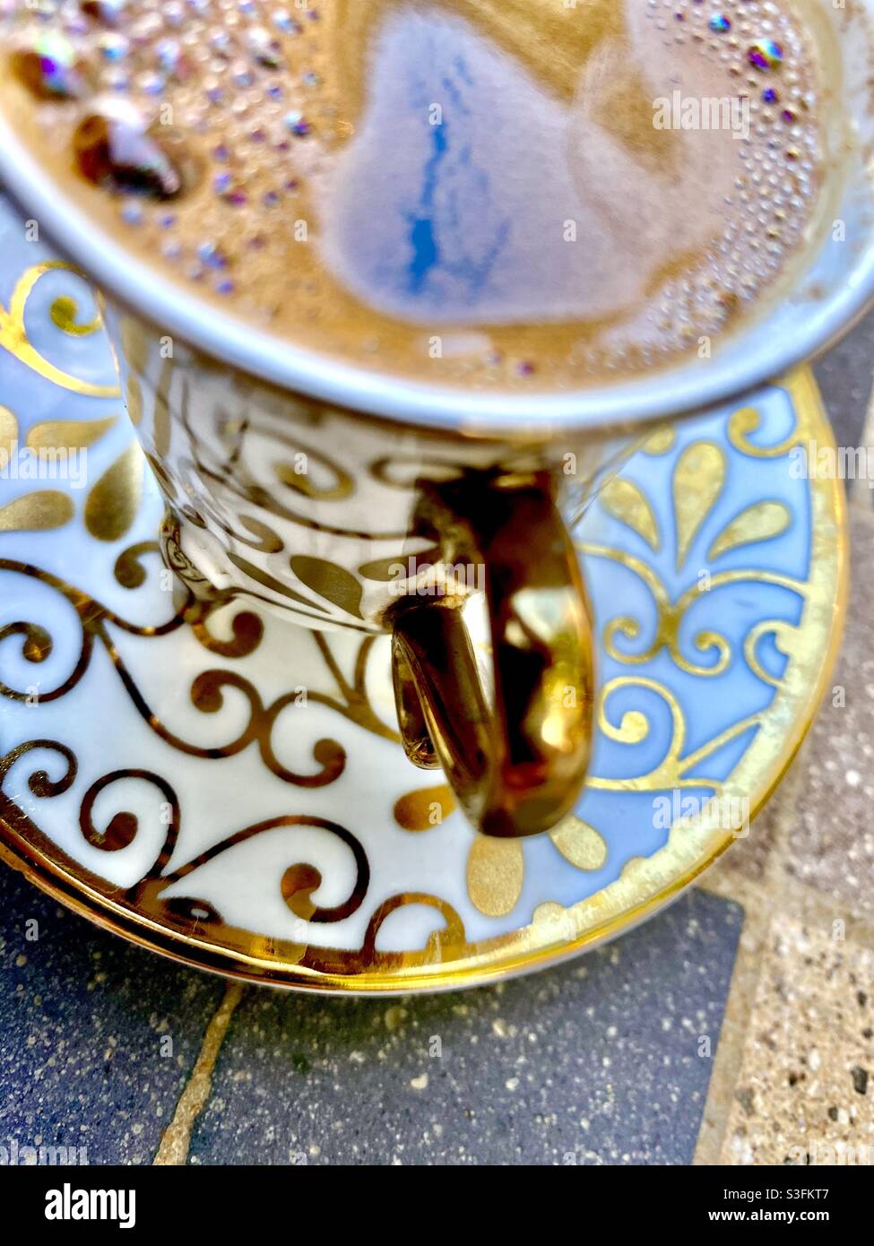 Turkish coffee serves in ornate gold-trimmed cup Stock Photo