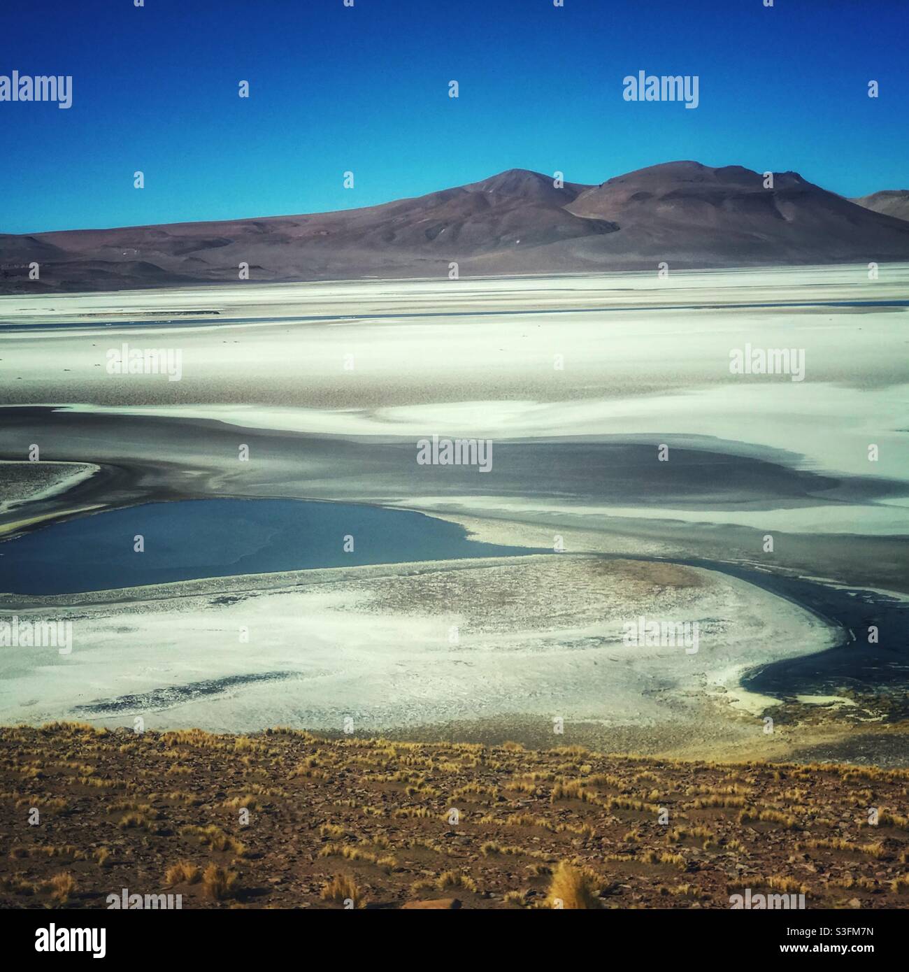 Salt flat outside San Pedro de Atacama, Chile seen from the bus on the way to Salta, northern Argentina - Smartphone Captured Stock Image