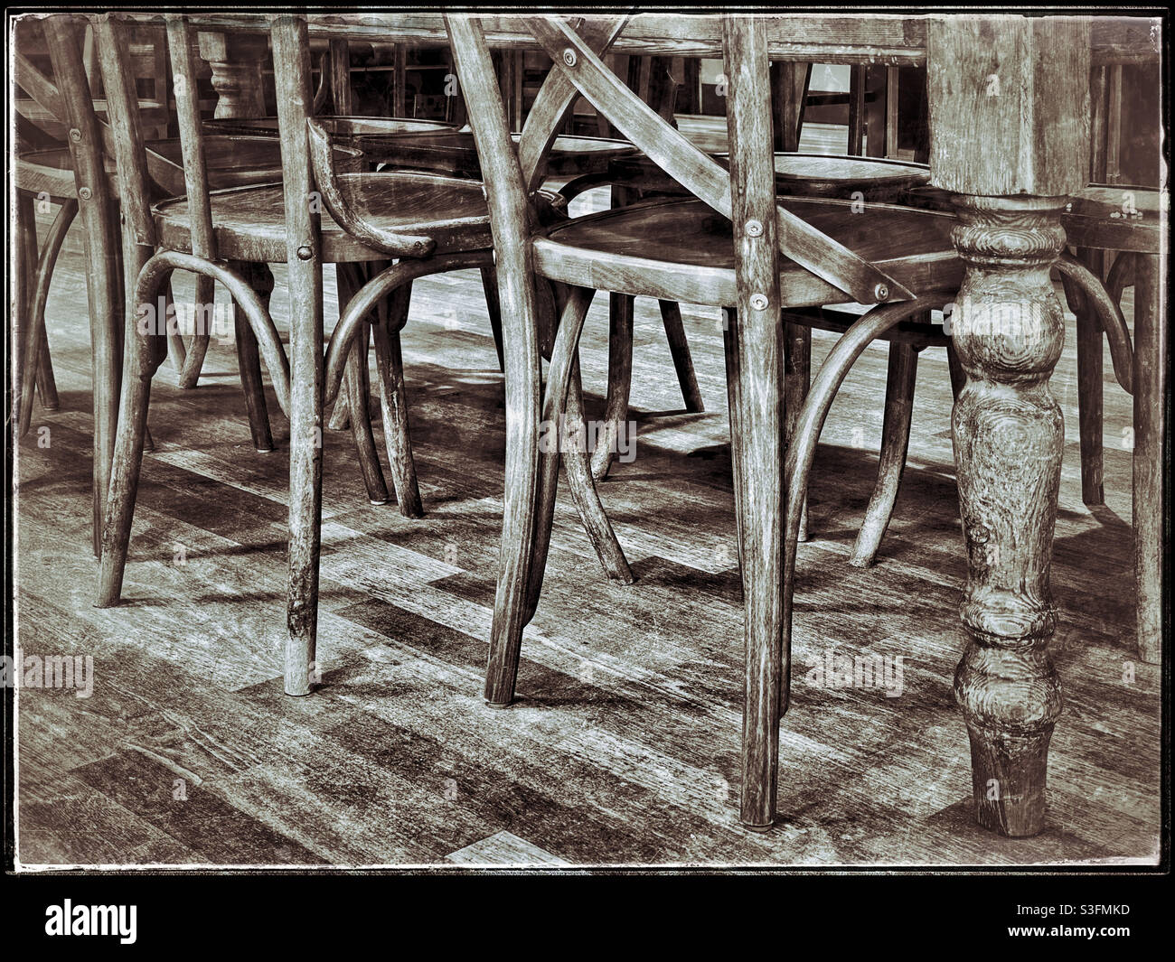 Retro effect image of chair legs. There’s a lot of wood in this picture ! Photo Credit - ©️ COLIN HOSKINS. - Smartphone Captured Stock Image