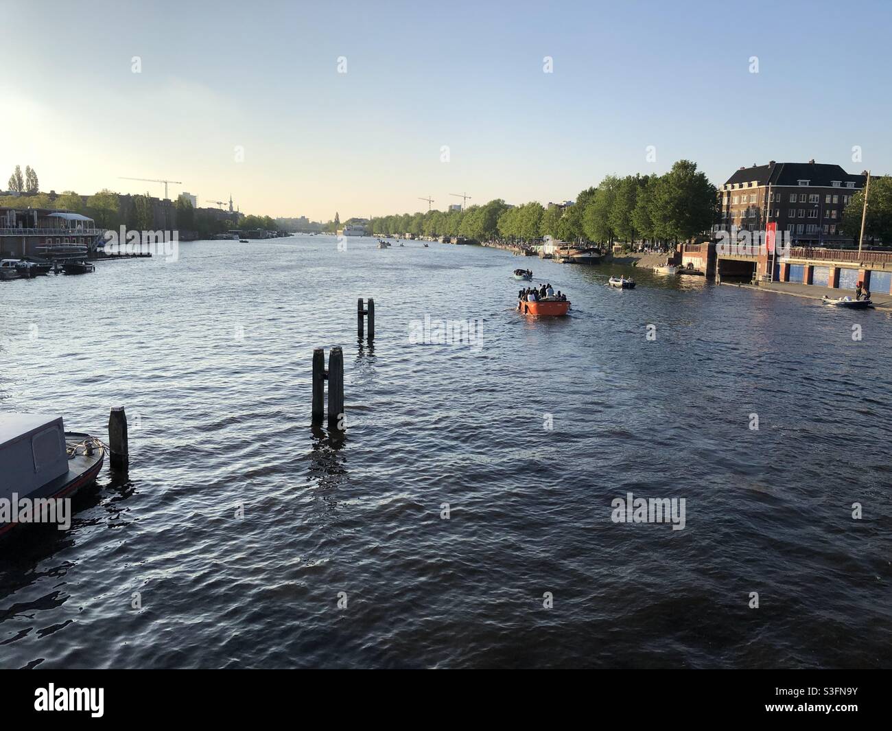 Summer night in Amsterdam, along the Amstel river Stock Photo