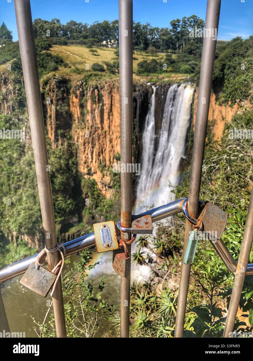 Howick Falls in the background behind the railing with the locks attached Stock Photo