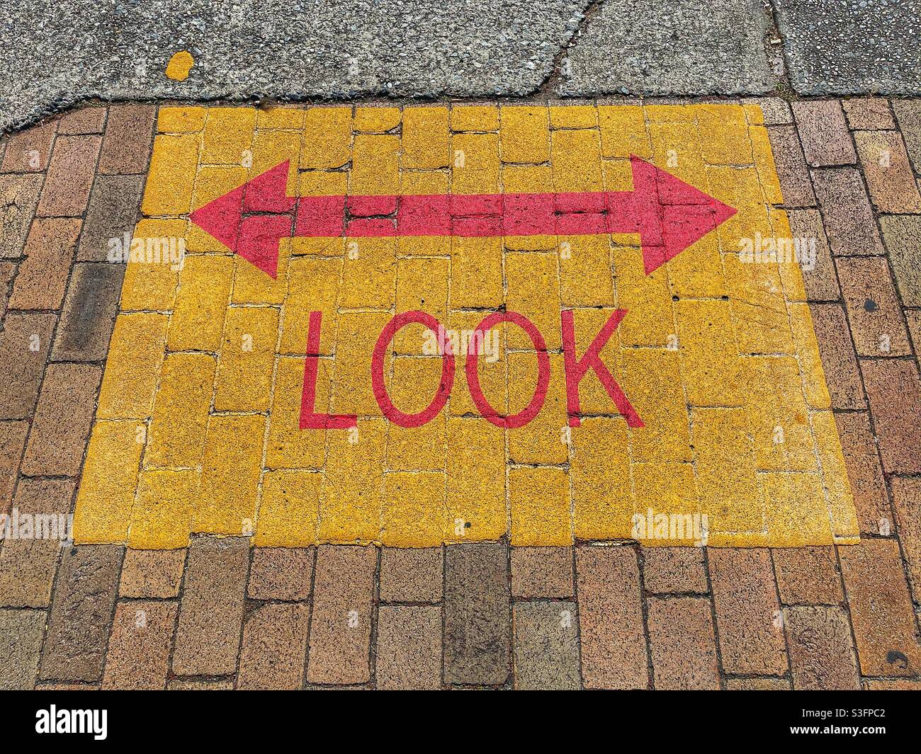 Look left and right signage on a footpath in Brisbane, Queensland, Australia Stock Photo