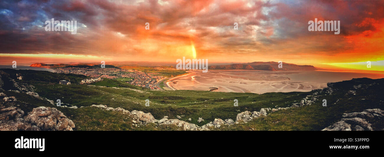 A spectacular view of the Conwy Valley, the Snowdonia Mountain range and a rainbow taken from the Great Orme, Llandudno, North Wales. - Smartphone Captured Stock Image