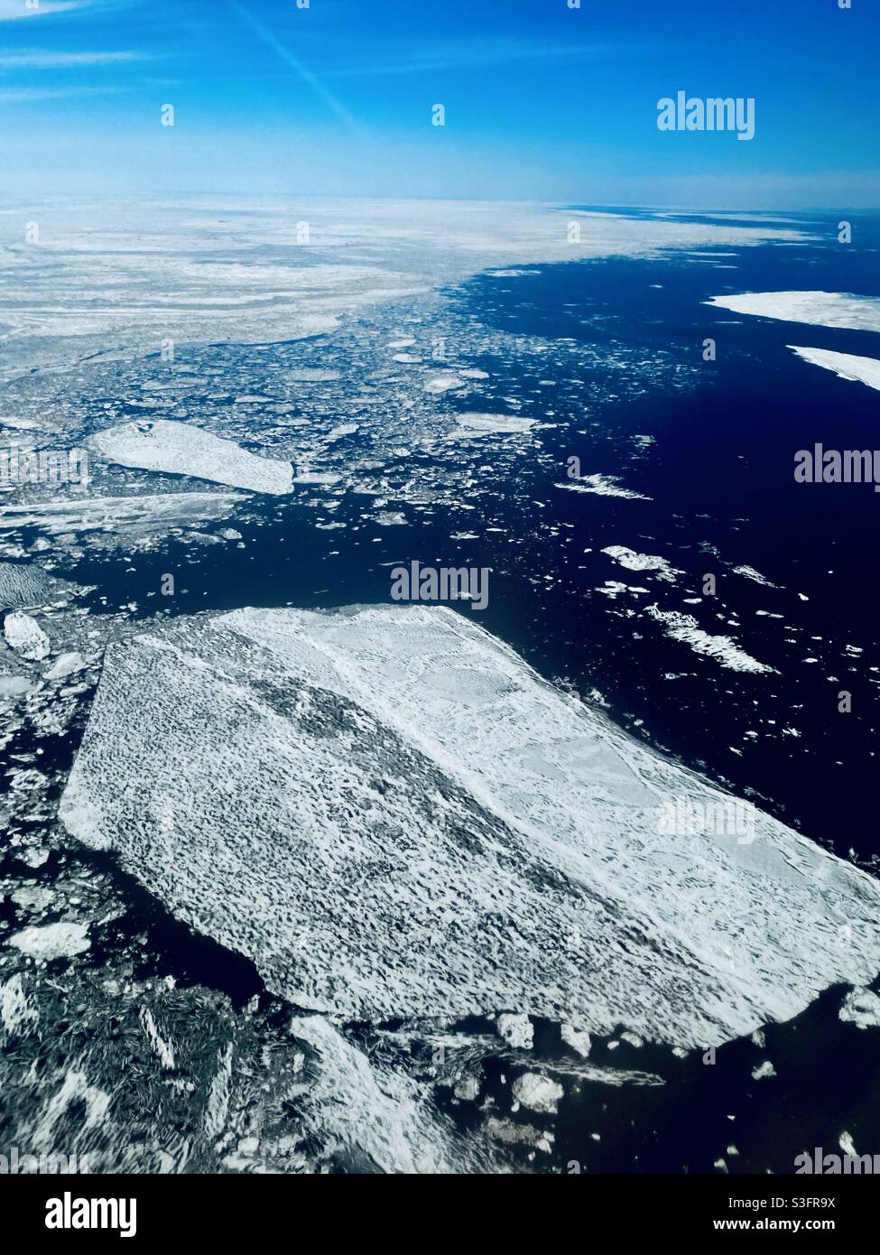 Melting sheets of sea ice in the Bering Strait/North Pacific Ocean northwest of Nome, Alaska. Stock Photo