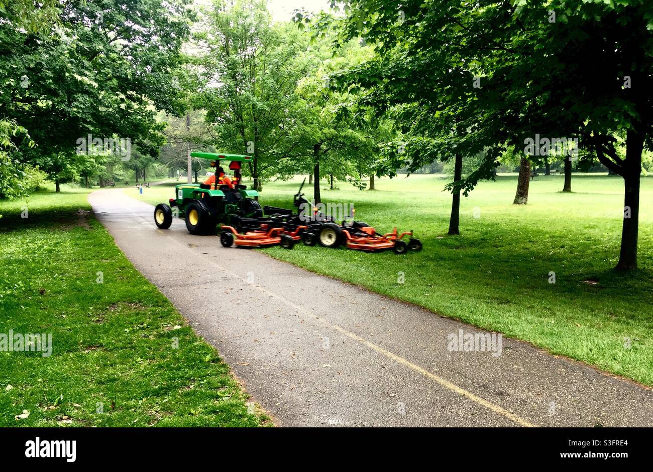 Mowing the grass in a big park, Ontario, Canada - Smartphone Captured Stock Image
