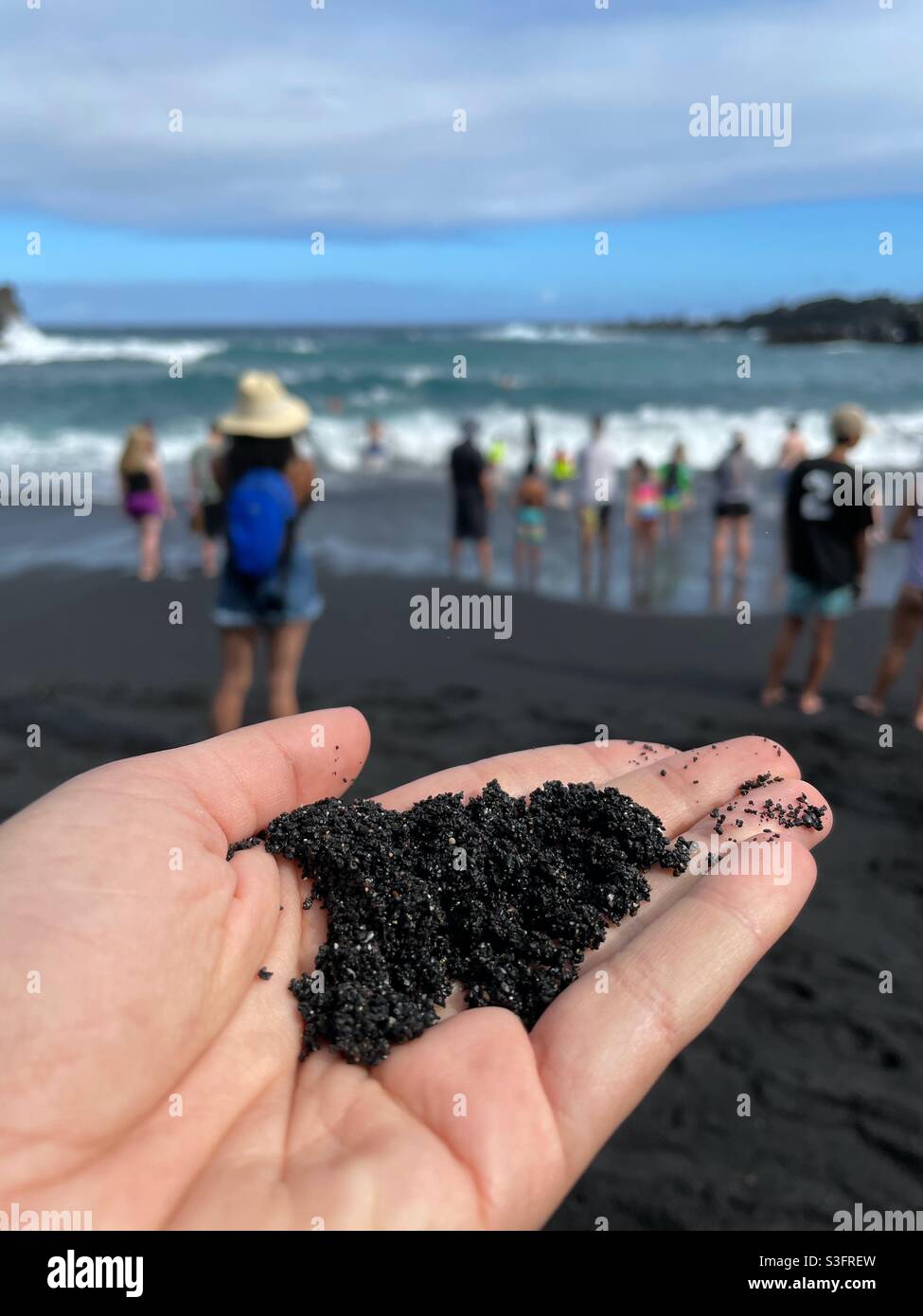 Black sand at a Black Sand Beach on the Road to Hana, Maui, Hawaii