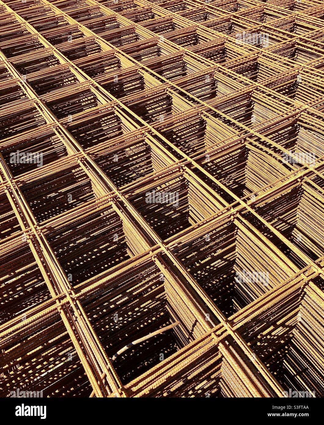 Stack of rusty steel reinforcing rods. Stock Photo