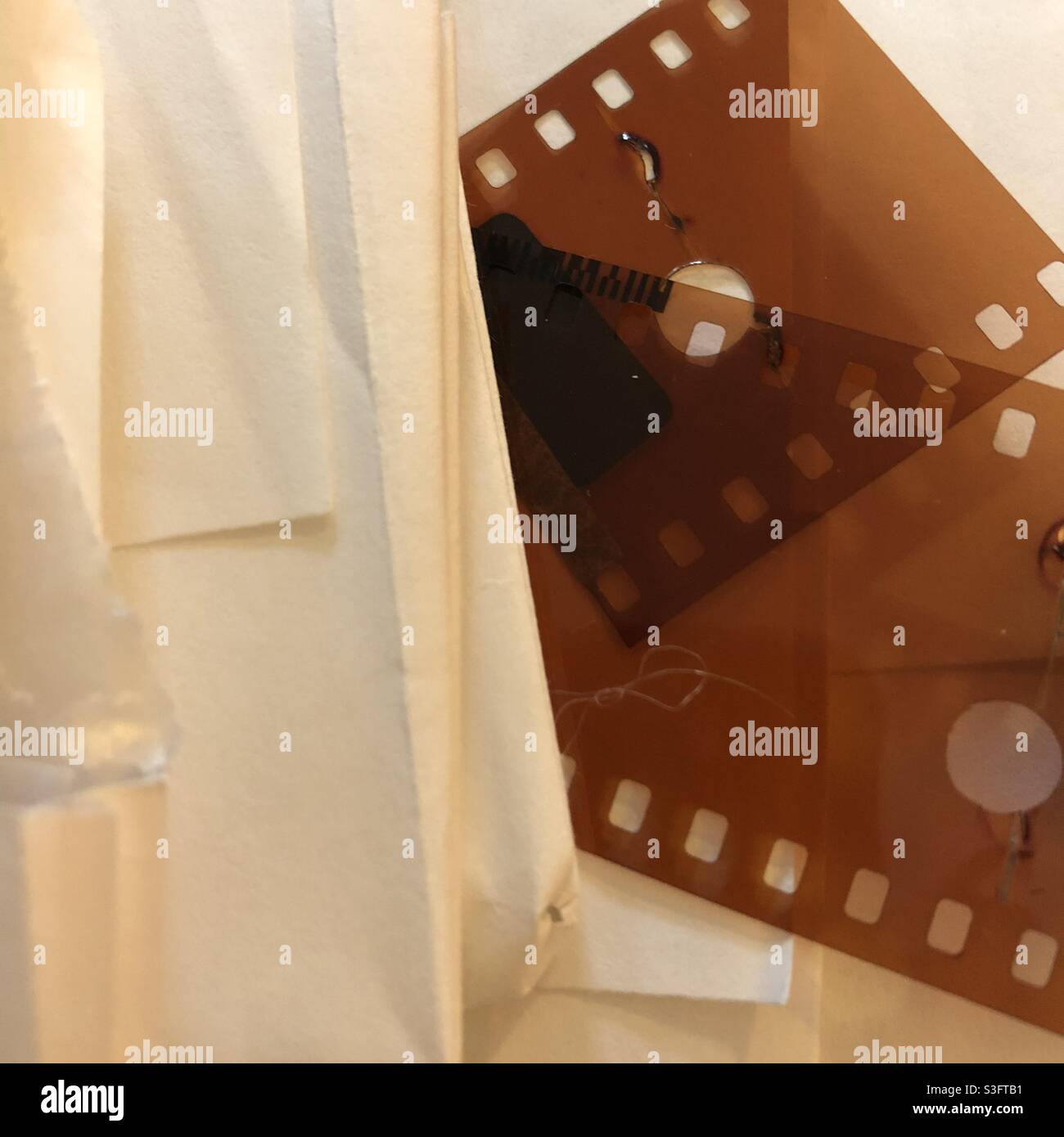 Downsizing and destashing photos and film negatives - Smartphone Captured Stock Image