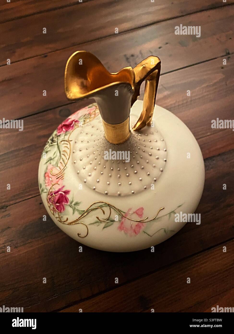 Vintage china hand painted pitcher has an elegant neck and handle, USA - Smartphone Captured Stock Image