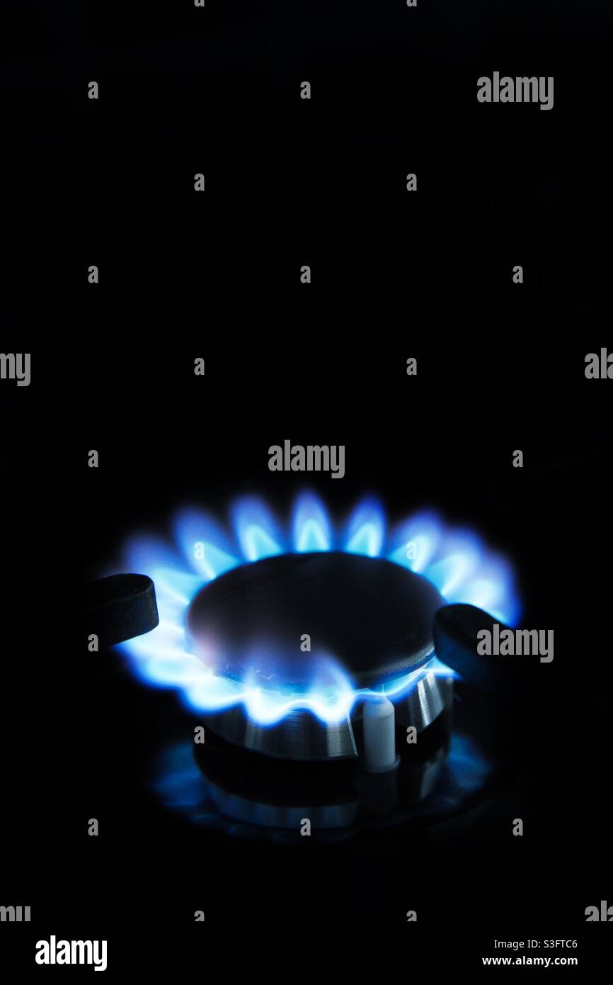 A ring of blue flame from a gas stove or cooker top with a copy space - Smartphone Captured Stock Image
