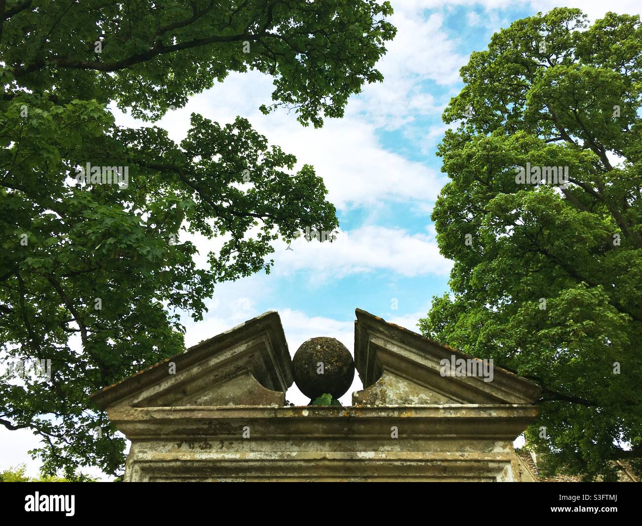 Top of the Garden Gate East of Avebury Manor, Wiltshire, UK. Made from limestone, the gateway was made in the early to mid 18th century and is a Grade II Listed Building. Stock Photo