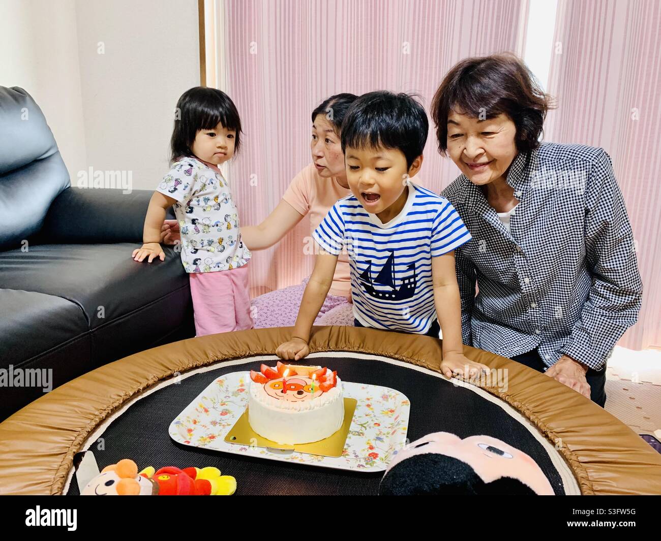 A Japanese Chakma two-year-old daughter’s simple birthday celebration during the Covid-19 State of Emergency in Tokyo, Japan, held on June 6, 2021, while Hosana Hamada-Chakma became two years old. Stock Photo